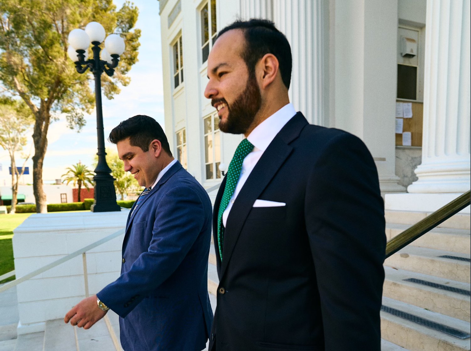 Mario Vela and Armando Galván on the steps of the Imperial County courthouse